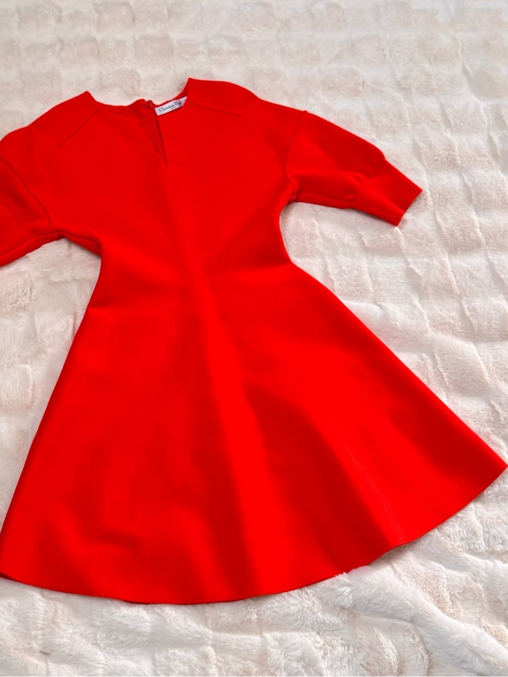 Christian Dior wool dress featuring short puff sleeves and a flared skirt